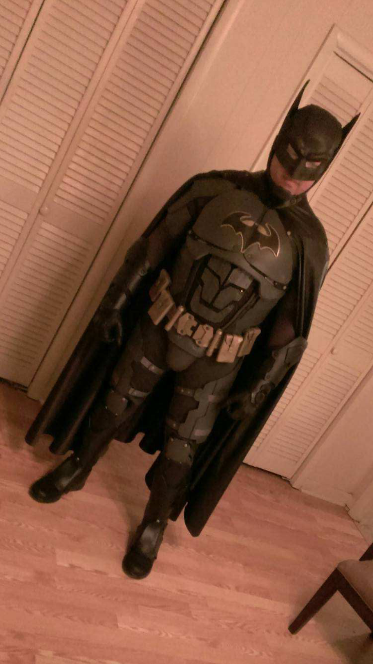 Mervin wearing a full Batman costume with cape and cowl