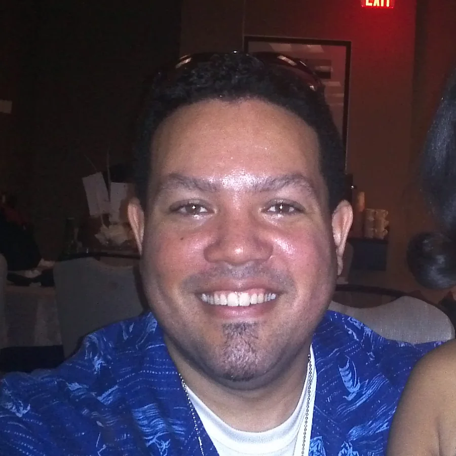A close portrait of Mervin smiling